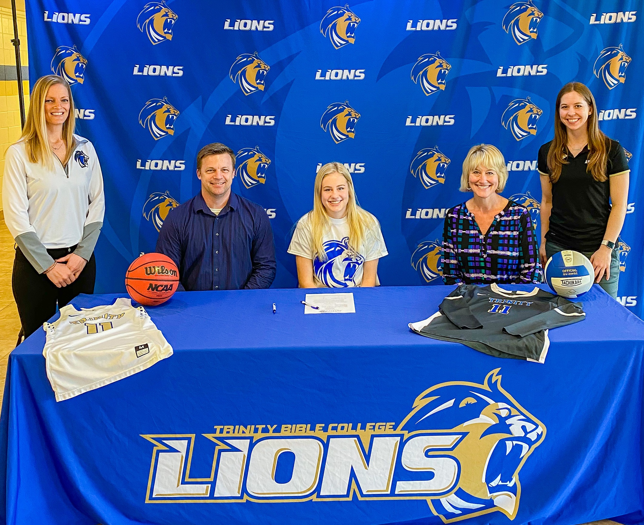Lions Volleyball and Basketball Sign Morgan Carlson